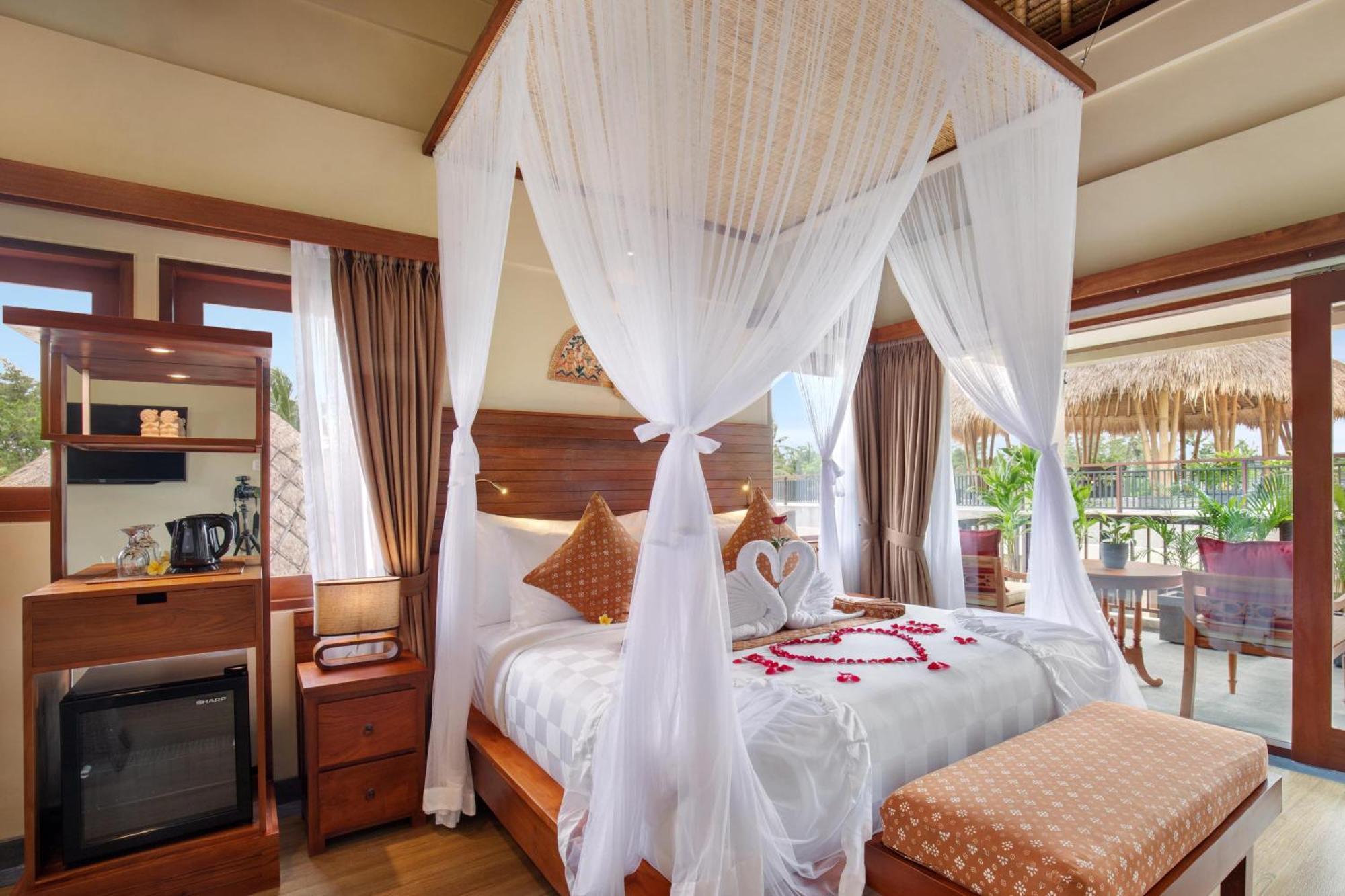 Ubud Nyuh Bali Resort & Spa Pokoj fotografie A canopy bed
